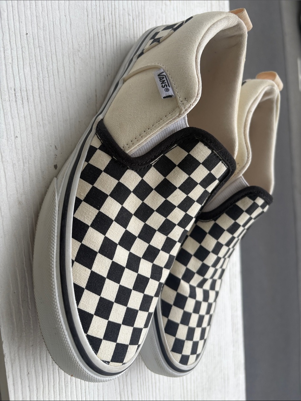 Vans Black and Cream Checkerboard Slip-On Sneakers